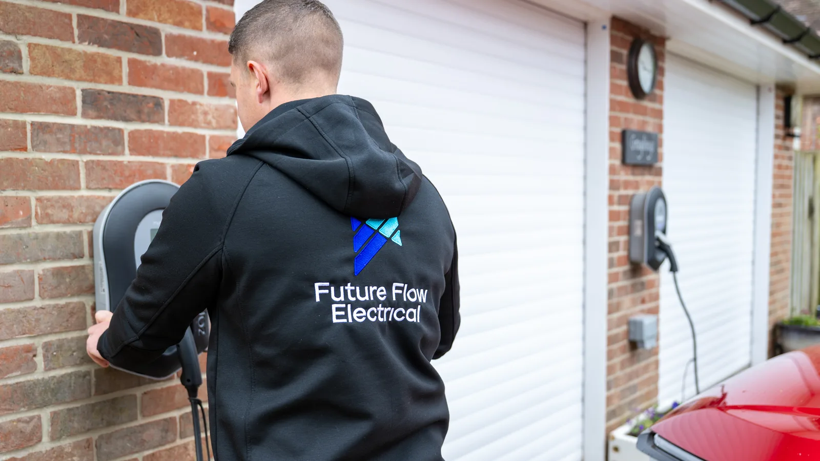 Two Future Flow charge points installed at one property, one beside each garage door