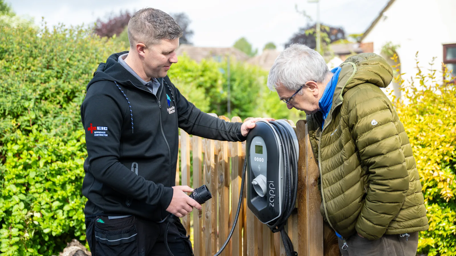 Future Flow electrician going through a newly installed home EV charge point with the customer