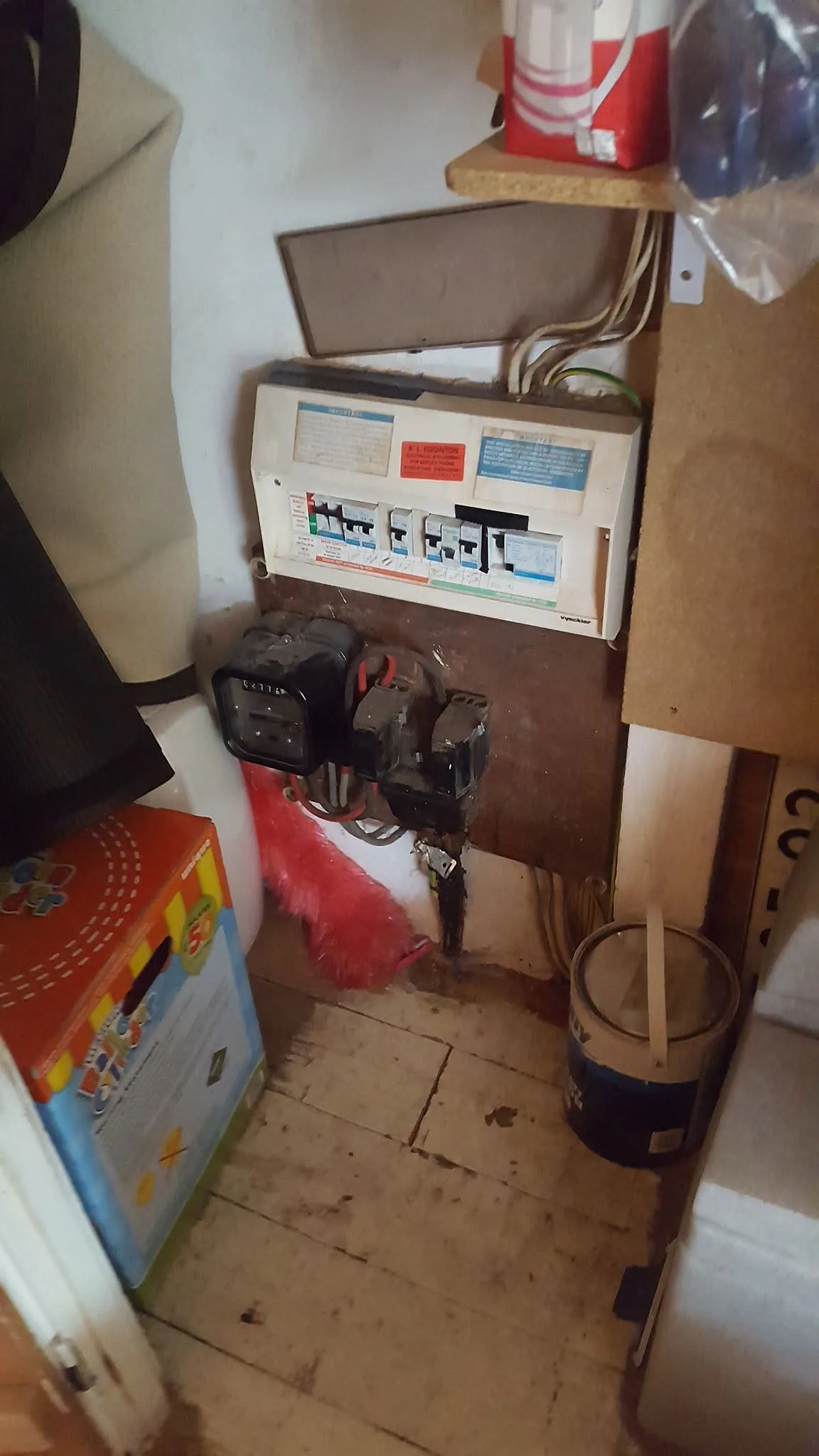 Electrician inspecting wiring during a house rewire in Salisbury