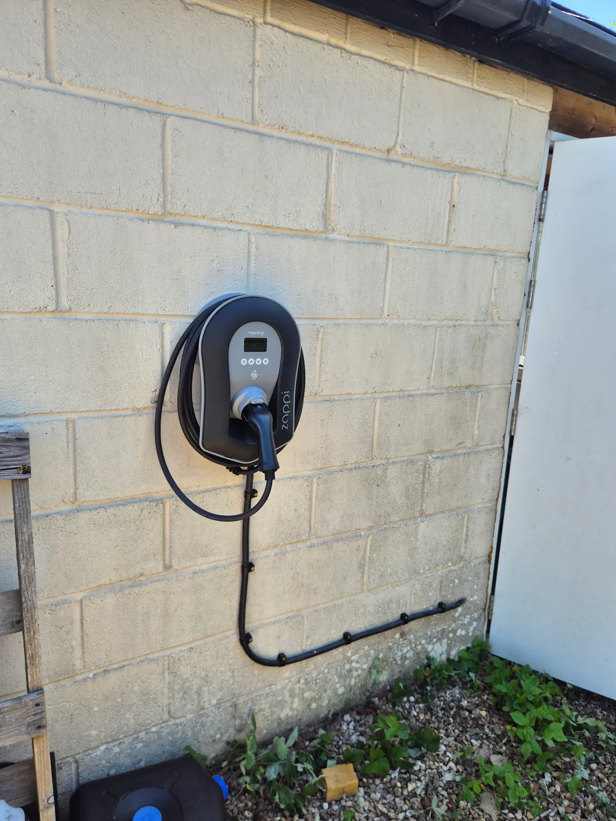 Myenergi Zappi 2 charge point fitted to a garage wall in Sandleheath near Fordingbridge