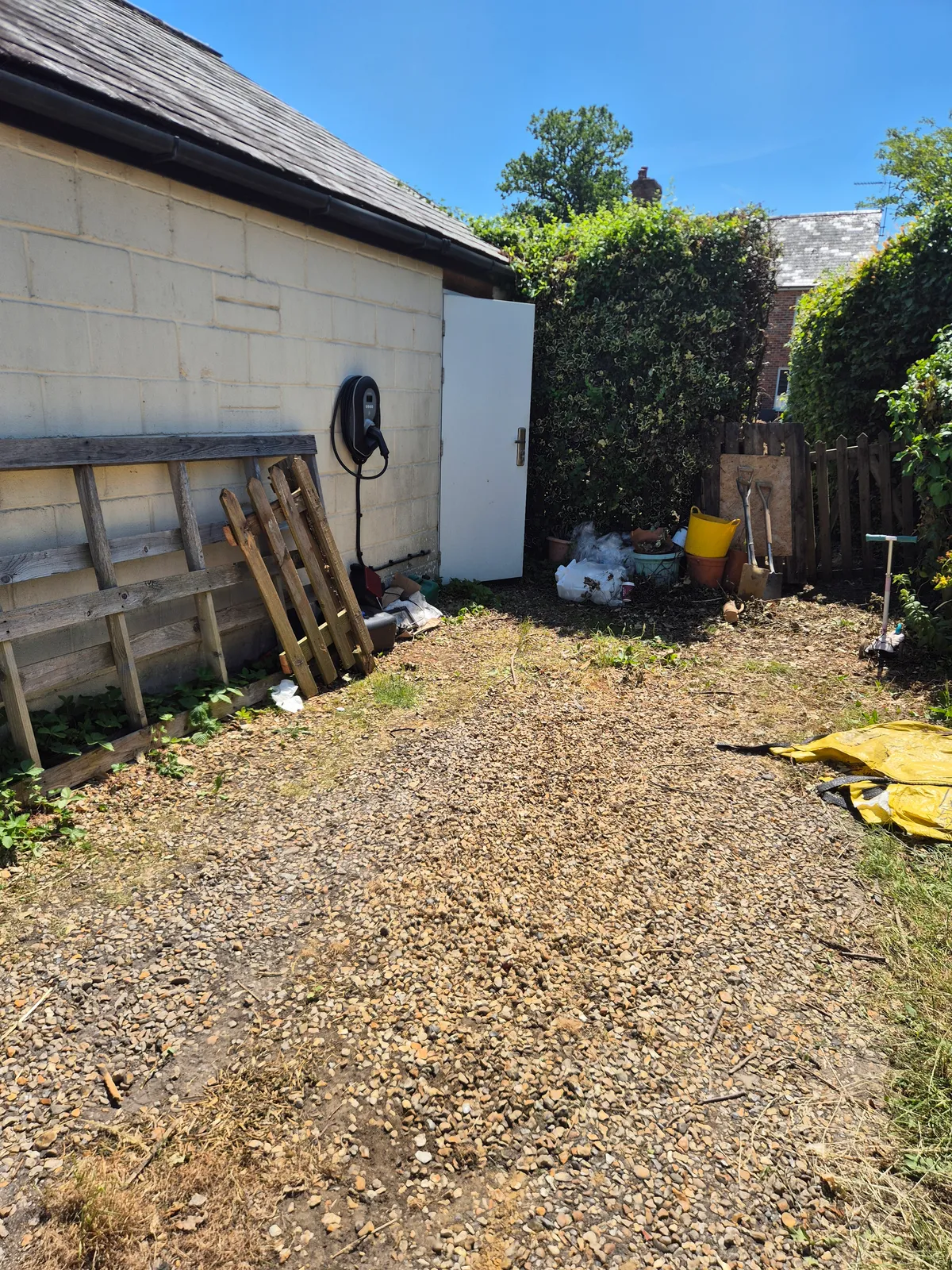 The detached garage at the bottom of the garden where the charge point was installed